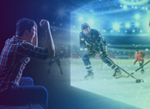 man excited and cheering while streaming live hockey game